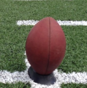 how to kick a football off a tee